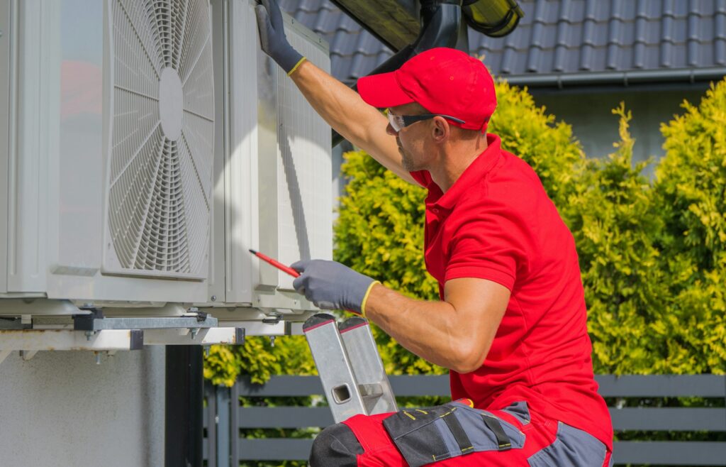 Residential Air Conditioning Maintenance Technician at Work